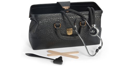 Doctors medical bag with stethocope coming out of top and ear viewer and tongue depressors on the table surface